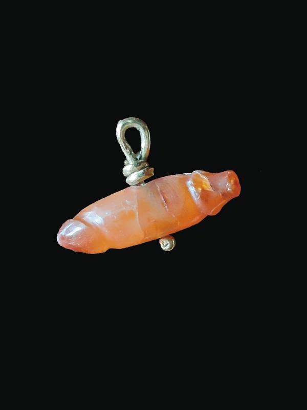 Met or double rotating phallus. Amulet. Ptolemaic period. Carnelian.